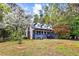 Charming two-story home with front porch, mature trees, and landscaped front yard at 2425 Shiloh Sw Dr, Marietta, GA 30064