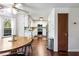 Bright eat-in kitchen featuring white cabinets, stainless steel appliances, and hardwood floors at 2425 Shiloh Sw Dr, Marietta, GA 30064