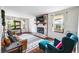 Inviting living room featuring a brick fireplace, hardwood floors, and lots of natural light at 2425 Shiloh Sw Dr, Marietta, GA 30064
