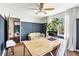 Inviting home office with large desk, comfortable sofa and natural light at 2425 Shiloh Sw Dr, Marietta, GA 30064
