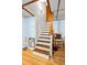 Wooden staircase featuring white risers and a playful chalkboard in the basement at 2425 Shiloh Sw Dr, Marietta, GA 30064