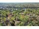 Aerial view of property at 250 Martin Ridge Ct near Martin Lake, surrounded by lush greenery and mature trees at 250 Martin Ridge Ct, Roswell, GA 30076