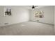 Large bedroom featuring a ceiling fan and two windows at 250 Martin Ridge Ct, Roswell, GA 30076