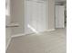 Bright bedroom features neutral carpet, a foldable desk and a large closet with bi-fold doors at 250 Martin Ridge Ct, Roswell, GA 30076
