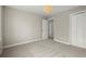 Bright bedroom features neutral carpet, a ceiling light fixture and closet with bi-fold doors at 250 Martin Ridge Ct, Roswell, GA 30076