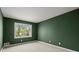 The green bedroom features a large window and neutral carpet at 250 Martin Ridge Ct, Roswell, GA 30076