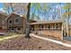 Inviting two-story home featuring neutral siding, a brick foundation, and a charming front porch at 250 Martin Ridge Ct, Roswell, GA 30076