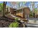 Charming home with a combination of neutral siding and brick, featuring a welcoming front porch and two-car garage at 250 Martin Ridge Ct, Roswell, GA 30076