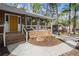 Charming front porch with brick steps, a bright yellow door, and hanging plants creating a welcoming entrance at 250 Martin Ridge Ct, Roswell, GA 30076
