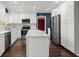 Bright kitchen features white cabinets, stainless appliances, and a large island perfect for food preparation at 250 Martin Ridge Ct, Roswell, GA 30076