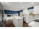 Bright kitchen with white cabinets, island, and stainless appliances at 250 Martin Ridge Ct, Roswell, GA 30076