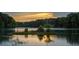 Picturesque lake view showcasing a small island with lush greenery and calm water reflecting the sky at 250 Martin Ridge Ct, Roswell, GA 30076