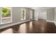 Hardwood floor living room with large windows and view to an outside porch at 250 Martin Ridge Ct, Roswell, GA 30076
