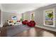 Cozy living room with hardwood floors, bright windows, and stylish furnishings at 250 Martin Ridge Ct, Roswell, GA 30076