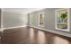 Spacious living room with gleaming hardwood floors, bright windows, and modern trim at 250 Martin Ridge Ct, Roswell, GA 30076