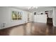 Living room boasts hardwood floors, a large window, and a back door with deck access at 250 Martin Ridge Ct, Roswell, GA 30076