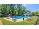 A beautiful community pool is surrounded by lounge chairs and green space at 250 Martin Ridge Ct, Roswell, GA 30076