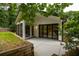 Outdoor view of the back of the home with a screened-in porch, patio, and sliding glass doors at 3063 Leafwood Dr, Decatur, GA 30033