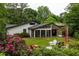 Backyard view with lush plants, lawn and a glimpse of the home, creating a serene outdoor space at 3063 Leafwood Dr, Decatur, GA 30033