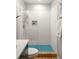 Stylish bathroom featuring a glass shower with white subway tile and a teal mosaic floor at 3063 Leafwood Dr, Decatur, GA 30033