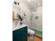 Modern bathroom boasting a glass-enclosed shower with white subway tile and teal mosaic floor at 3063 Leafwood Dr, Decatur, GA 30033
