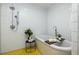 Stylish bathroom with a modern tub, sleek fixtures, and minimalist white tile design at 3063 Leafwood Dr, Decatur, GA 30033