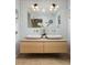 Stylish bathroom with a double vanity, hexagon tiled mirror wall, and modern fixtures at 3063 Leafwood Dr, Decatur, GA 30033