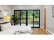 Bright bedroom featuring sliding glass doors leading to a private outdoor patio and garden at 3063 Leafwood Dr, Decatur, GA 30033