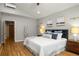 Relaxing bedroom design in light tones, with a padded headboard and stylish wall decor at 3063 Leafwood Dr, Decatur, GA 30033