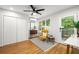 Airy bedroom featuring wood floors, closet, access to the deck, and ample natural light at 3063 Leafwood Dr, Decatur, GA 30033