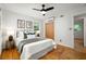 Charming bedroom with a comfortable bed, ceiling fan, closet, and natural light streaming through the windows at 3063 Leafwood Dr, Decatur, GA 30033