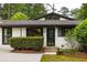 Charming single story home features mature landscaping and updated front door at 3063 Leafwood Dr, Decatur, GA 30033