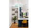 Bright kitchen with bar seating and modern lighting, offering a seamless flow to the dining area and living spaces at 3063 Leafwood Dr, Decatur, GA 30033