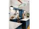 Modern kitchen with stainless steel appliances, sleek cabinetry, herringbone backsplash, and hardwood floors at 3063 Leafwood Dr, Decatur, GA 30033