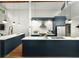 Modern kitchen with stainless steel appliances, sleek cabinetry, white countertop and hardwood floors at 3063 Leafwood Dr, Decatur, GA 30033