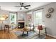 Cozy living room with a fireplace, stylish decor, and ample natural light at 3063 Leafwood Dr, Decatur, GA 30033