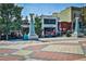A view of the town square with restaurant fronts, and artful pillars and landscaping at 3063 Leafwood Dr, Decatur, GA 30033