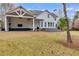 Expansive backyard with a covered patio, ideal for outdoor entertaining and relaxation at 3642 Falls Trl, Winston, GA 30187