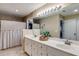 Bathroom featuring double sinks, a large mirror, and tiled floors and walls at 3642 Falls Trl, Winston, GA 30187