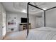 Spacious bedroom featuring a four-poster bed, built-in bookcase, and tray ceiling with a ceiling fan at 3642 Falls Trl, Winston, GA 30187