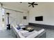 Relaxing covered patio with comfortable seating, a ceiling fan, and a mounted television at 3642 Falls Trl, Winston, GA 30187
