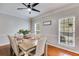 Elegant dining room with hardwood floors, natural light, and a six-chair dining set at 3642 Falls Trl, Winston, GA 30187
