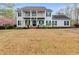 Charming two-story home with a covered porch, balcony, and a spacious front yard at 3642 Falls Trl, Winston, GA 30187