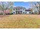 Charming two-story home with a covered porch, balcony, and a spacious front yard at 3642 Falls Trl, Winston, GA 30187