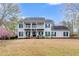 Charming two-story home with a covered porch, balcony, and a spacious front yard at 3642 Falls Trl, Winston, GA 30187