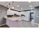 Traditional style kitchen with custom cabinets, tile backsplash, and breakfast bar at 3642 Falls Trl, Winston, GA 30187