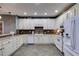 Traditional style kitchen with custom cabinets, tile backsplash, and sleek appliances at 3642 Falls Trl, Winston, GA 30187