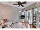 Inviting living room filled with natural light from large windows and hardwood floors at 3642 Falls Trl, Winston, GA 30187