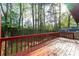 Wooden back deck with backyard views of mature trees and wooden fence at 1248 Falling Water Se Dr, Smyrna, GA 30080