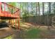 View of the backyard featuring a wooden fence and the deck at 1248 Falling Water Se Dr, Smyrna, GA 30080